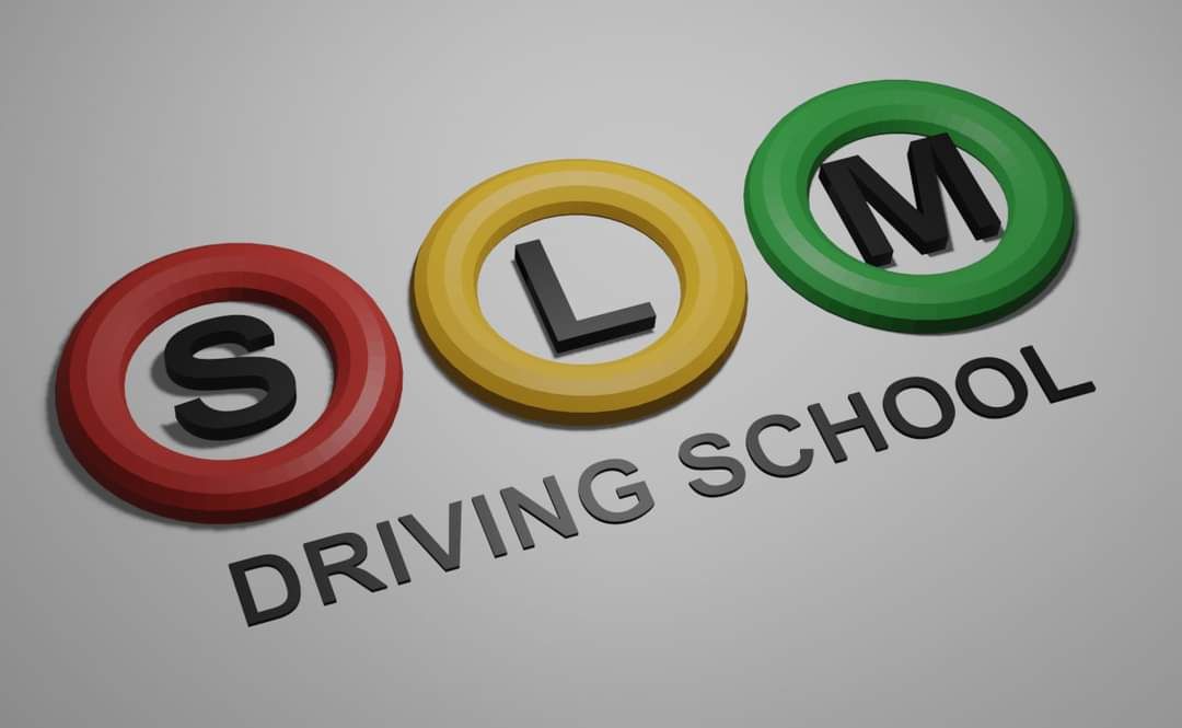 Happy learner driver in a modern automatic car smiling at the camera